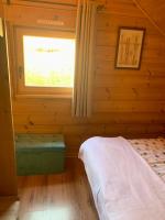 Łóżko lub łóżka w pokoju w obiekcie Chalet cosy au cœur du Dévoluy avec vue magnifique