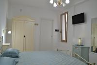 A bed or beds in a room at Arbor Exclusive B&B