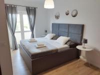 Posteľ alebo postele v izbe v ubytovaní Apartmani Sladić