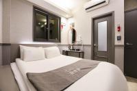 Hotel dongyangjang Dongdaemun-Jongnoにあるベッド