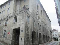a large stone building with arches on a street at O&#39;Couvent - Appartement 62 m2 - 2 chambres - A513 in Salins-les-Bains