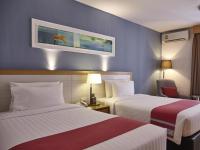Postel nebo postele na pokoji v ubytování Maple Hotel