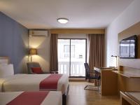 Postel nebo postele na pokoji v ubytování Maple Hotel