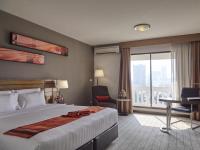 Postel nebo postele na pokoji v ubytování Maple Hotel