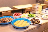 a table with bowls of different types of food at APA Hotel Namba Ekihigashi in Osaka