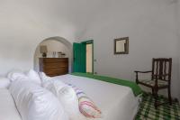 Posteľ alebo postele v izbe v ubytovaní Trulli Il Cappero by Perle di Puglia