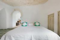 Posteľ alebo postele v izbe v ubytovaní Trulli Il Cappero by Perle di Puglia