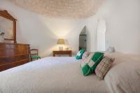 Posteľ alebo postele v izbe v ubytovaní Trulli Il Cappero by Perle di Puglia