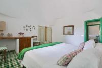 Posteľ alebo postele v izbe v ubytovaní Trulli Il Cappero by Perle di Puglia