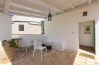 Patio alebo iná vonkajšia časť ubytovania Trulli Il Cappero by Perle di Puglia