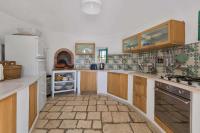 Kuchyňa alebo kuchynka v ubytovaní Trulli Il Cappero by Perle di Puglia