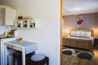 Postel nebo postele na pokoji v ubytování Soba i Apartman Đula