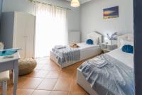 Posteľ alebo postele v izbe v ubytovaní Olive tree Apartment