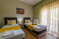 Posteľ alebo postele v izbe v ubytovaní Olive tree Apartment