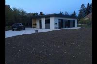 a house with a car parked in front of it at chez Gaby 