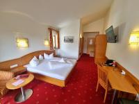 Televízia a/alebo spoločenská miestnosť v ubytovaní Das Alpin - Hotel Garni Guesthouse