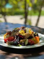 een bord eten op een tafel bij Villa Hautvallon - Peaceful Escape in Provence in Gordes