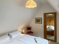 Postel nebo postele na pokoji v ubytování Haus *Üüs Aran* Wohnung Nr. 6