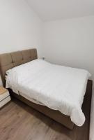 Posteľ alebo postele v izbe v ubytovaní Apartman Villa Adrijana
