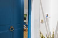a blue door next to a white wall at Villa in the Garden in Kokkini Khanion
