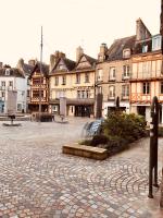 a cobblestone street in a town with buildings at Ty Kaz Old Kemper in Quimper