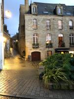 an old stone building in a city at night at Ty Kaz Old Kemper in Quimper