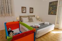 a childs bedroom with a bed with a crib and toys at Villa in the Garden in Kokkini Khanion