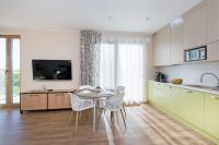 Kuchyňa alebo kuchynka v ubytovaní Bursztynowe Tarasy - Apartamenty