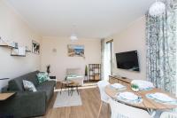 Televízia a/alebo spoločenská miestnosť v ubytovaní Bursztynowe Tarasy - Apartamenty
