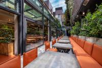 a row of benches in front of a restaurant at IOTA Hotel Tbilisi in Tbilisi City