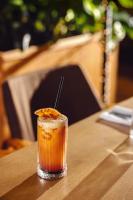 a drink sitting on a table on a table at IOTA Hotel Tbilisi in Tbilisi City