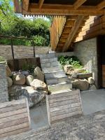 a set of stairs in a garden with rocks at Le Cabanon in Saint-Jorioz