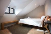 A bed or beds in a room at U-Sense Madrid Santa Ana