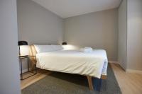 A bed or beds in a room at U-Sense Madrid Santa Ana