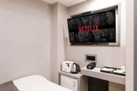 Hotel dongyangjang Dongdaemun-Jongnoにあるテレビまたはエンターテインメントセンター