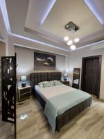 Posteľ alebo postele v izbe v ubytovaní Rika’s Luxury seaside apartment