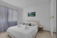 Postel nebo postele na pokoji v ubytování Hortenzija Apartments