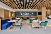 TV a/nebo společenská místnost v ubytování Hilton Garden Inn Zhuhai Jinan University