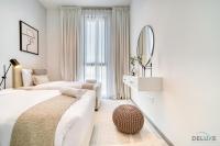 Postel nebo postele na pokoji v ubytování Harmonious 2BR with Assistant Room at Mesk 1 Midtown Dubai Production City by Deluxe Holiday Homes