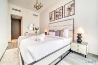 Postel nebo postele na pokoji v ubytování Harmonious 2BR with Assistant Room at Mesk 1 Midtown Dubai Production City by Deluxe Holiday Homes