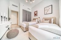 Postel nebo postele na pokoji v ubytování Harmonious 2BR with Assistant Room at Mesk 1 Midtown Dubai Production City by Deluxe Holiday Homes