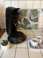 a coffee maker on a counter with two cups of coffee at #Le Rue des 2 Porches #F2 avec Cours #HyperCentre in Brive-la-Gaillarde