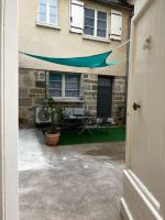 an open door of a house with a patio at #Le Rue des 2 Porches #F2 avec Cours #HyperCentre in Brive-la-Gaillarde