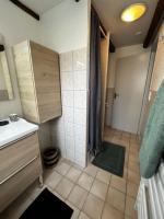 a small bathroom with a shower and a sink at #Le Rue des 2 Porches #F2 avec Cours #HyperCentre in Brive-la-Gaillarde