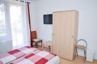Postel nebo postele na pokoji v ubytování SovaApartman
