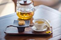 a tray with a cup of tea on a table at H&amp; Jiufen The Dragon Inn in Jiufen