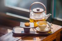a tray with a tea pot and a cup of tea at H&amp; Jiufen The Dragon Inn in Jiufen