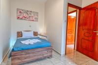 A bed or beds in a room at Armonia