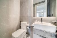 Koupelna v ubytování Suave 2BR with Assistant Room at Mesk 1 Midtown Dubai Production City by Deluxe Holiday Homes