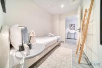 Postel nebo postele na pokoji v ubytování Suave 2BR with Assistant Room at Mesk 1 Midtown Dubai Production City by Deluxe Holiday Homes